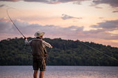 istock Senior Man Fly-Fishing at Sunset 1337989734