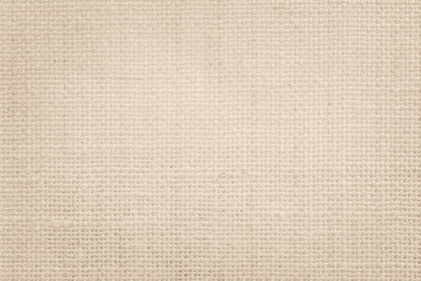 istock Jute hessian sackcloth canvas woven texture pattern background in light beige cream brown color blank empty 1337990991