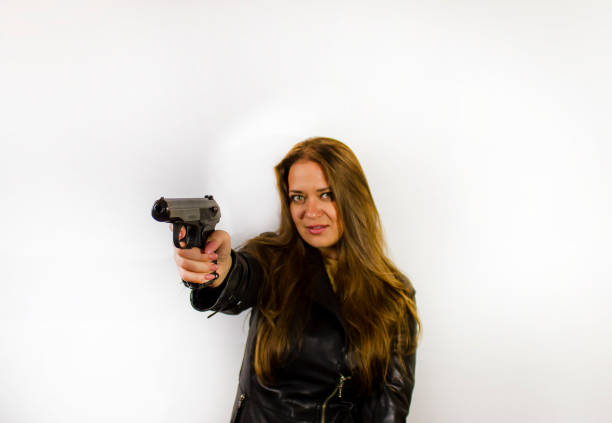 Young woman with long red hair stares ahead with an expression of uncertainty or anxiety.