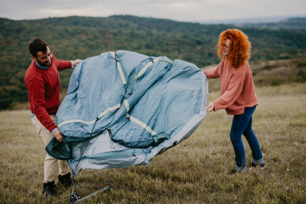 istock Campers unpacking a tent togehter 1337995213