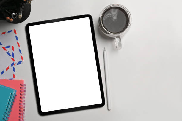 istock Digital tablet, stylus pen, notebook and coffee cup on white background. Flat lay. 1338002254