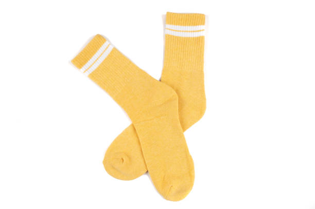 istock Pair of yellow socks isolated on white 1338004194