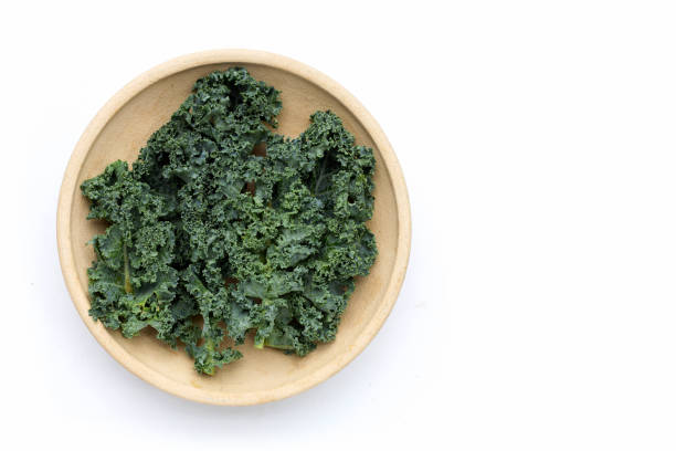 istock Kale leaves in white plate on white background. 1338004562