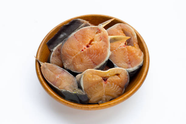 istock Catfish cut pieces in bowon bowl on white background. 1338005155
