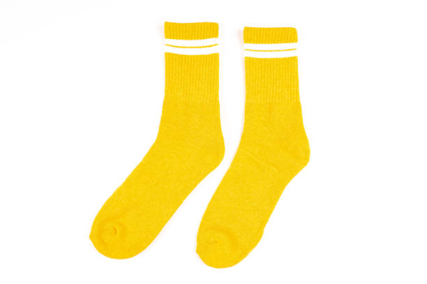istock Pair of yellow socks isolated on white 1338005166