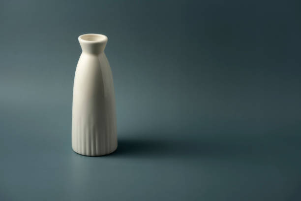 istock Still life: a ceramic bottle on a dark green background 1338006319
