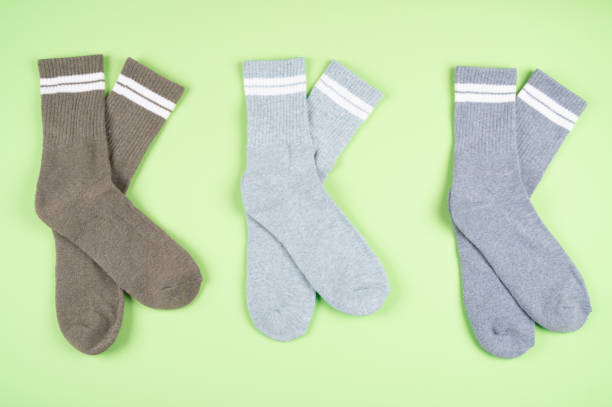 istock Set of warm socks on a pistachio-colored background 1338006373