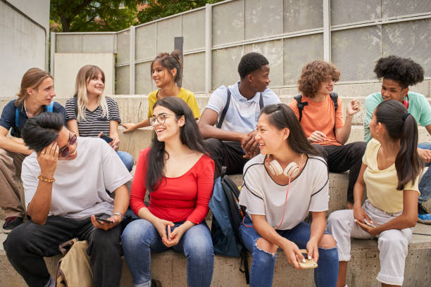 istock Multi-ethnic group of happy students on a break. 1338006385