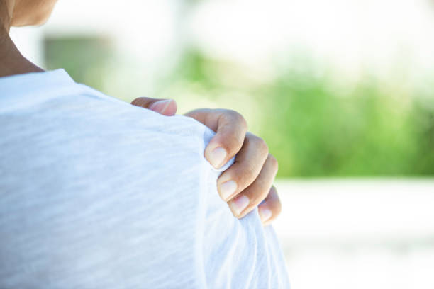 istock Woman With Shoulder Pain 1338007522
