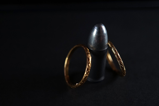 close up shot of bullet and rings