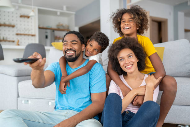 istock Family watching television 1338012137