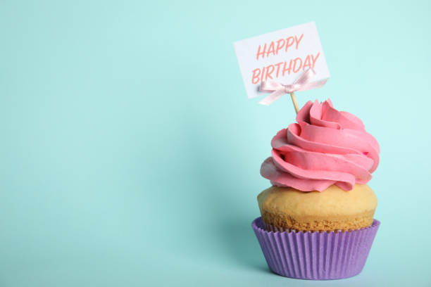 istock Beautiful birthday cupcake on light blue background. Space for text 1338017596
