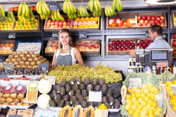 istock Posing cheerful woman and working man in shop 1338017855