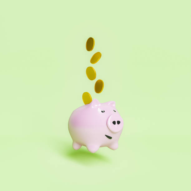 istock 3d piggy bank with coins falling on it 1338020606