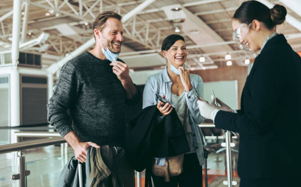 istock Couple boarding flight during pandemic 1338023181