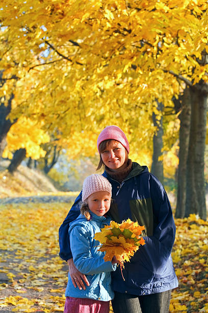 istock Family in autumn maple park 133802503