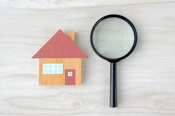 istock House object and magnifying glass on natural wooden table 1338025127