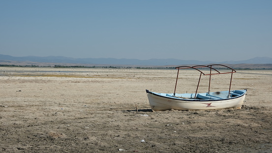 dried lake and sunken boat