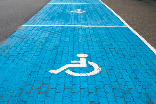 istock Handicap parking spots with blue and white painted marking 1338027374