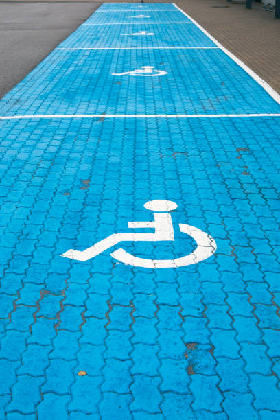 istock Handicap parking spots with blue and white painted marking 1338027380
