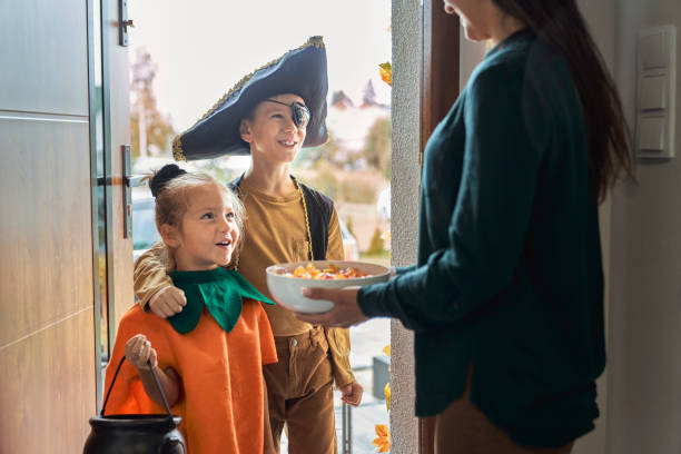 Children dressed in Halloween Costumes trick-or-treating
