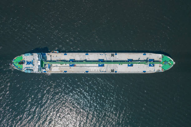 istock Cargo Ship docked at open sea close to harbour. Drone aerial bird eye view 1338028047