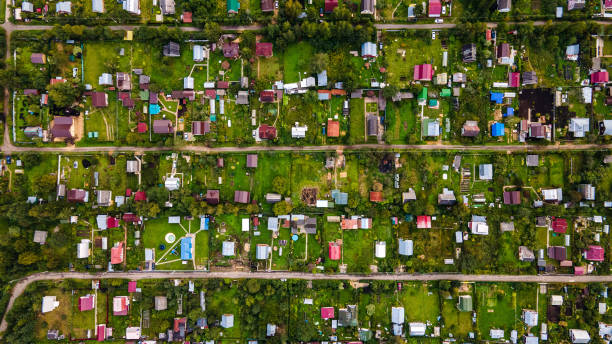 istock Flying over country houses directly above 1338029182