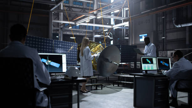 istock Engineer and Technician Working on Satellite Construction. Aerospace Agency: Diverse Team of Scientists Using Technological Equipment and Laptop Computer to Develop Spacecraft for Space Exploration. 1338031094