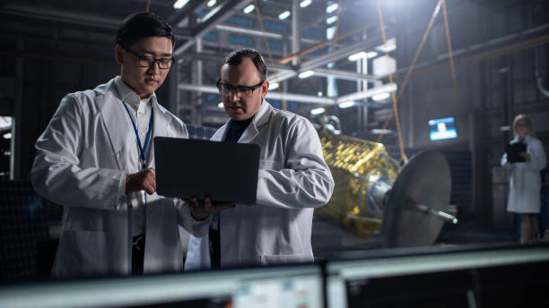 istock Engineer and Technician Working on Satellite Construction. Aerospace Agency: Diverse Team of Scientists Using Technological Equipment and Laptop Computer to Develop Spacecraft for Space Exploration. 1338031152