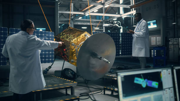istock Engineer and Technician Working on Satellite Construction. Aerospace Agency: Diverse Team of Scientists Using Technological Equipment and Tablet Computer to Develop Spacecraft for Space Exploration. 1338031161