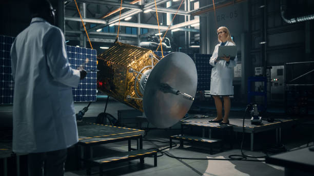 istock Engineer and Technician Working on Satellite Construction. Aerospace Agency: Diverse Team of Scientists Using Technological Equipment and Laptop Computer to Develop Spacecraft for Space Exploration. 1338031675