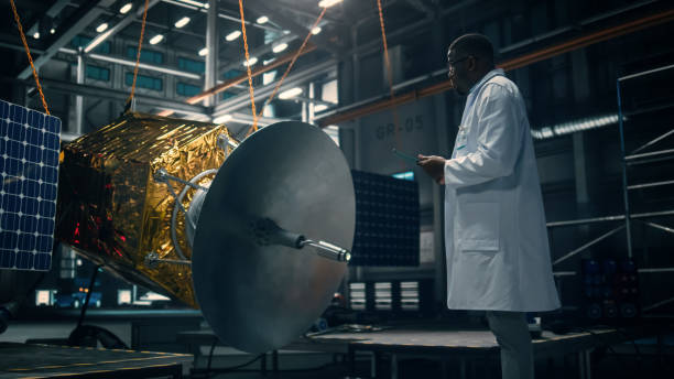 istock Industrial Engineer Working on Artificial Satellite Construction. Aerospace Agency: African American Scientist Using Tablet Computer to Develop Spacecraft for Space Exploration and Data Communication. 1338031676