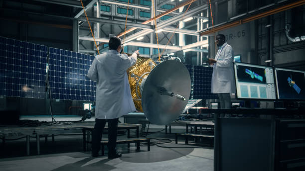 istock Engineer and Technician Working on Satellite Construction. Aerospace Agency: Diverse Team of Scientists Using Technological Equipment and Tablet Computer to Develop Spacecraft for Space Exploration. 1338031691