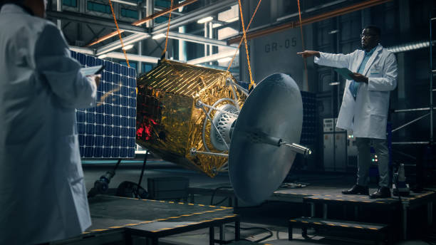 istock Engineer and Technician Working on Satellite Construction. Aerospace Agency: Diverse Team of Scientists Using Technological Equipment and Tablet Computer to Develop Spacecraft for Space Exploration. 1338031694
