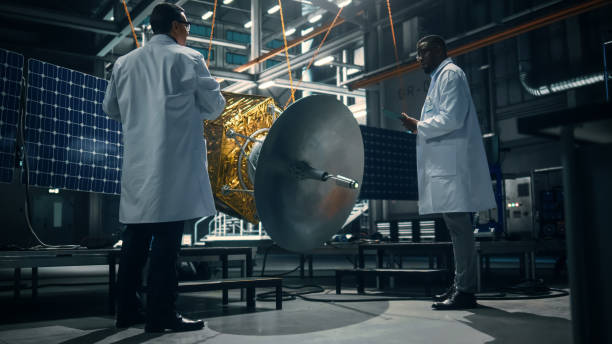 istock Engineer and Technician Working on Satellite Construction. Aerospace Agency: Diverse Team of Scientists Using Technological Equipment and Tablet Computer to Develop Spacecraft for Space Exploration. 1338031696