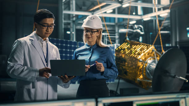 istock Engineer and Technician Working on Satellite Construction. Aerospace Agency: Diverse Team of Scientists Using Technological Equipment and Laptop Computer to Develop Spacecraft for Space Exploration. 1338031719