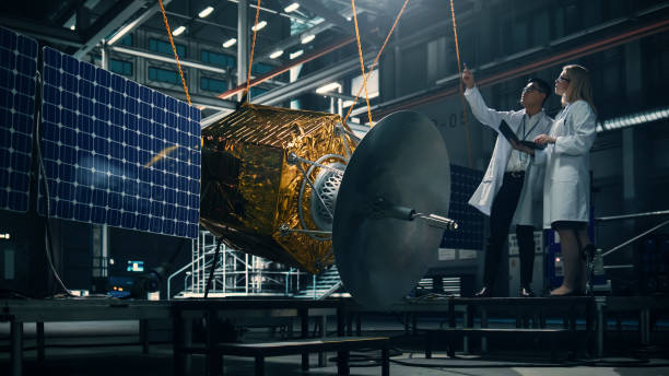 istock Engineer and Technician Working on Satellite Construction. Aerospace Agency: Diverse Team of Scientists Using Technological Equipment and Laptop Computer to Develop Spacecraft for Space Exploration. 1338031743