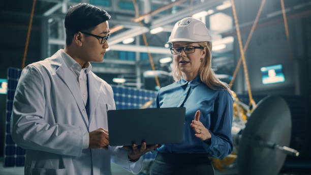 istock Engineer and Technician Working on Satellite Construction. Aerospace Agency: Diverse Team of Scientists Using Technological Equipment and Laptop Computer to Develop Spacecraft for Space Exploration. 1338031757