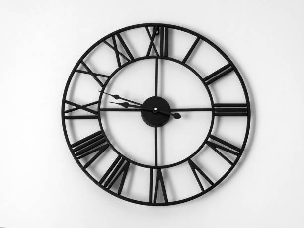 istock Clock with roman numbers on the wall 1338033428
