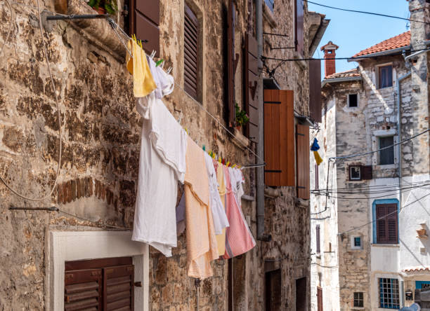 istock Old alley with laundry in Croatia 1338034188