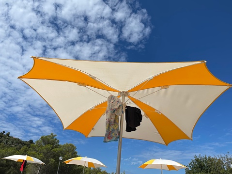 White parasol in the summer sunshine