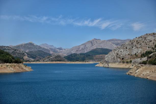 istock A lake sorrounding by mountains 1338038323