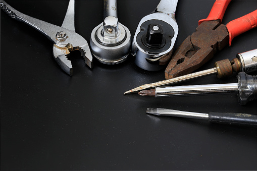 Different construction tools with Hand tools for home renovation on black background maintenance and reparing concept.