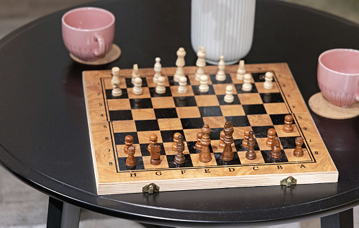 Wooden Chess Board at Coffee Table in Home