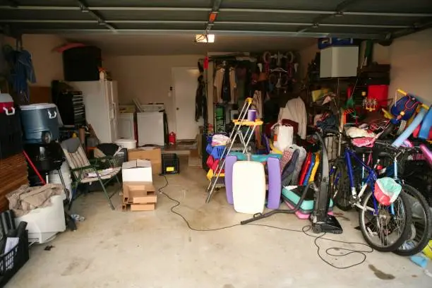 Photo of messy abandoned garage full of stuff