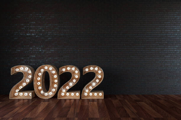 istock 2022 Bulb Sign Against Black Wall 1338043627