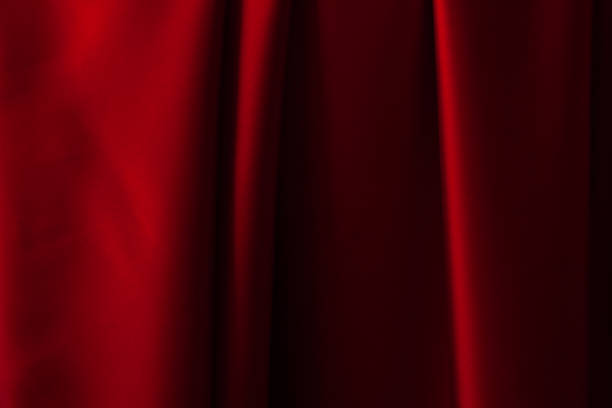 istock Red fabric texture background. Silk satin folds 1338046538