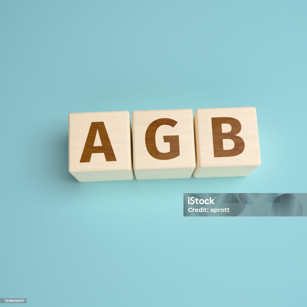 "AGB" - the German abbreviation for "Allgemeine Geschäftsbedingungen" (Terms and Conditions) built from letters on wooden cubes. High angle view with copy space Alphabet Stock Photo
