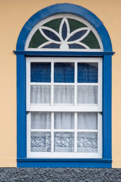 istock Brazilian colonial house window facade in a yellow wall 1338048324