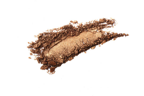 istock Crushed golden eyeshadow smear.Isolated on white.Professional cosmetics. 1338049008